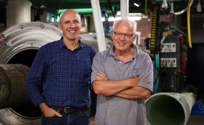 Professor Richard Morgan (right) at the UQ Centre of Hypersonics ground-testing facility, with colleague Professor Michael Smart.